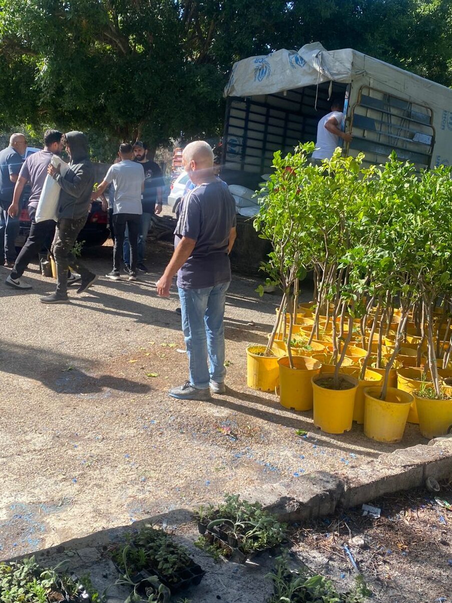 Farmers in South Lebanon receive agricultural kits from DCA containing compost, tools, heirloom seeds, native saplings, and seedlings to promote sustainable farming.